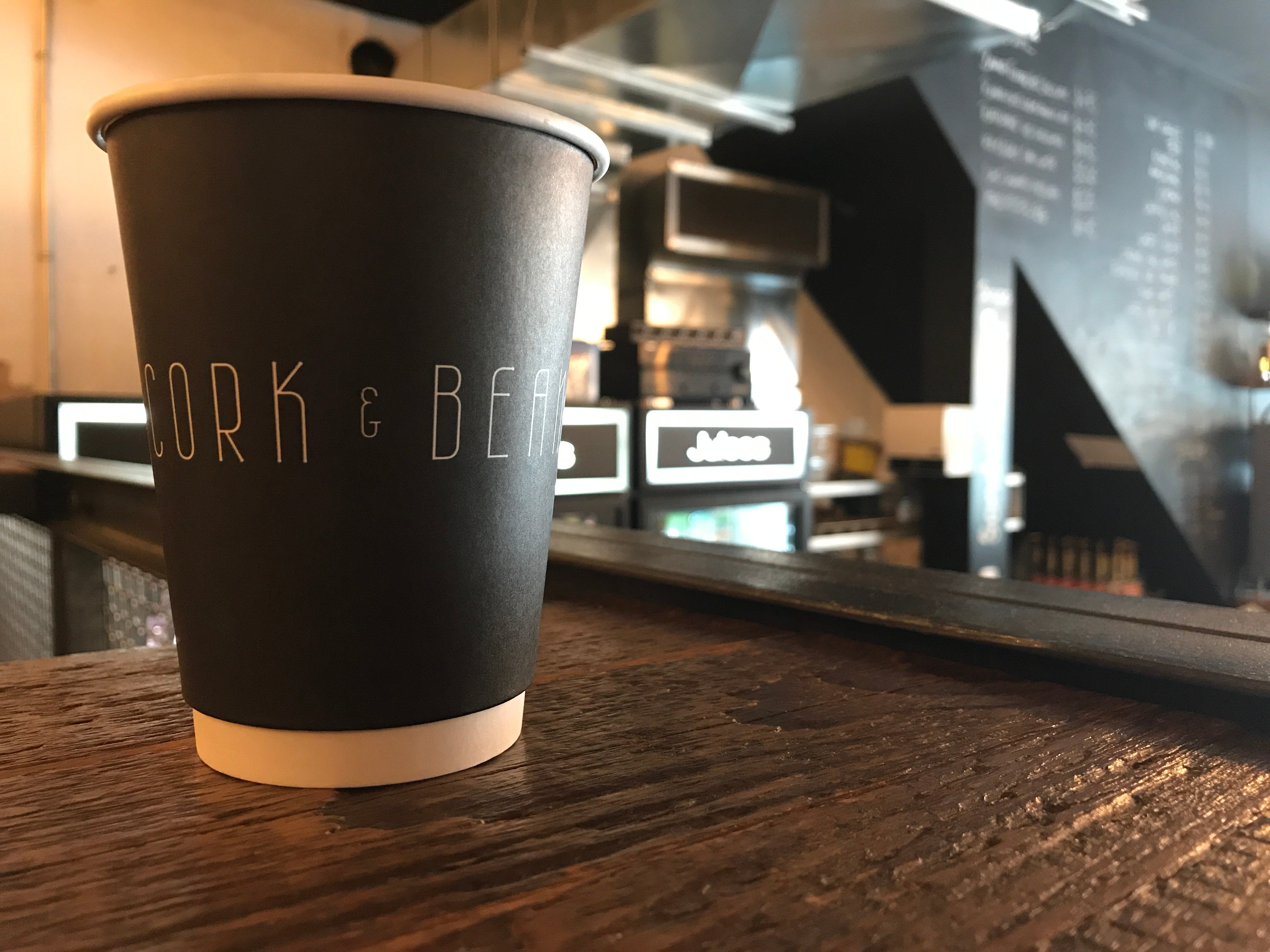 Cork and Bean coffee cup on counter