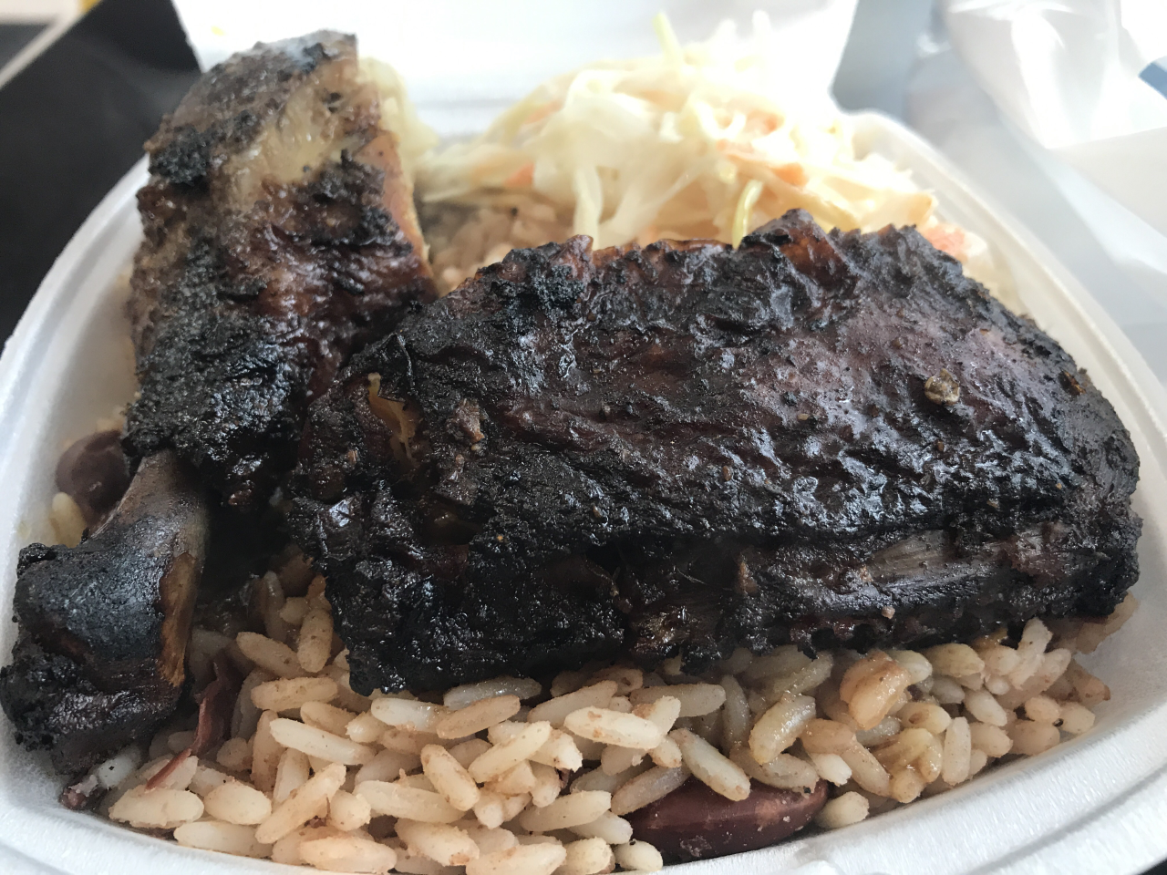 Jerk chicken on a bed of rice and peas