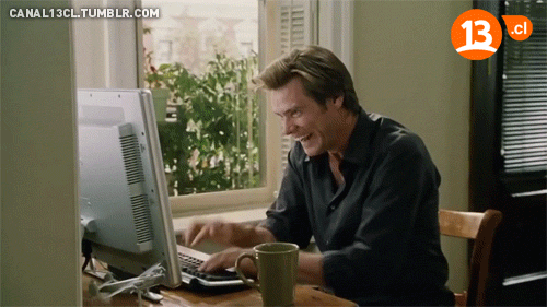 Jim Carrey typing intensely on a keyboard