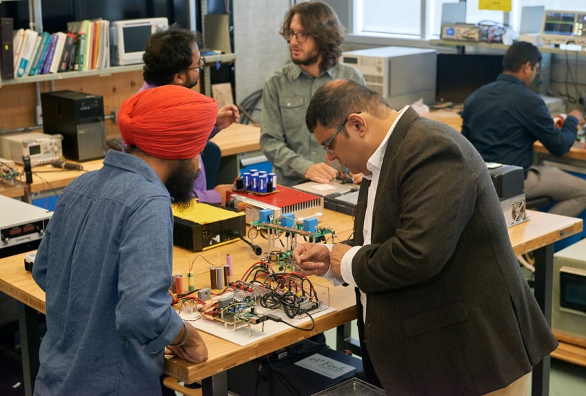 Two people working on mechatronics