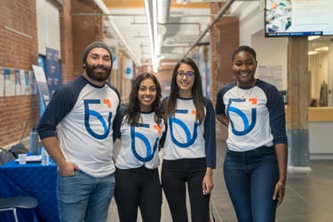 four students wearing Ontario Tech shirts