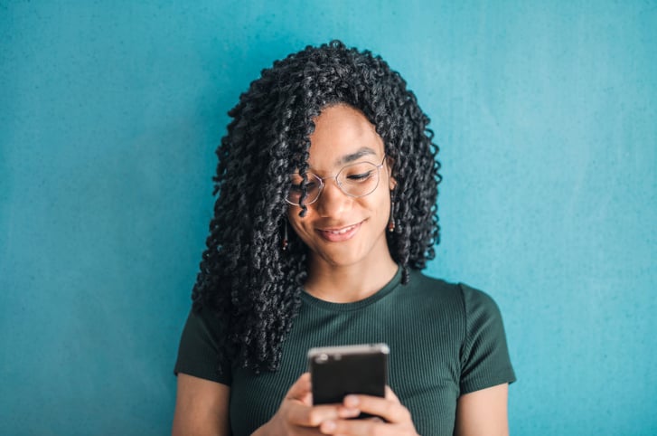 woman texting on her phone