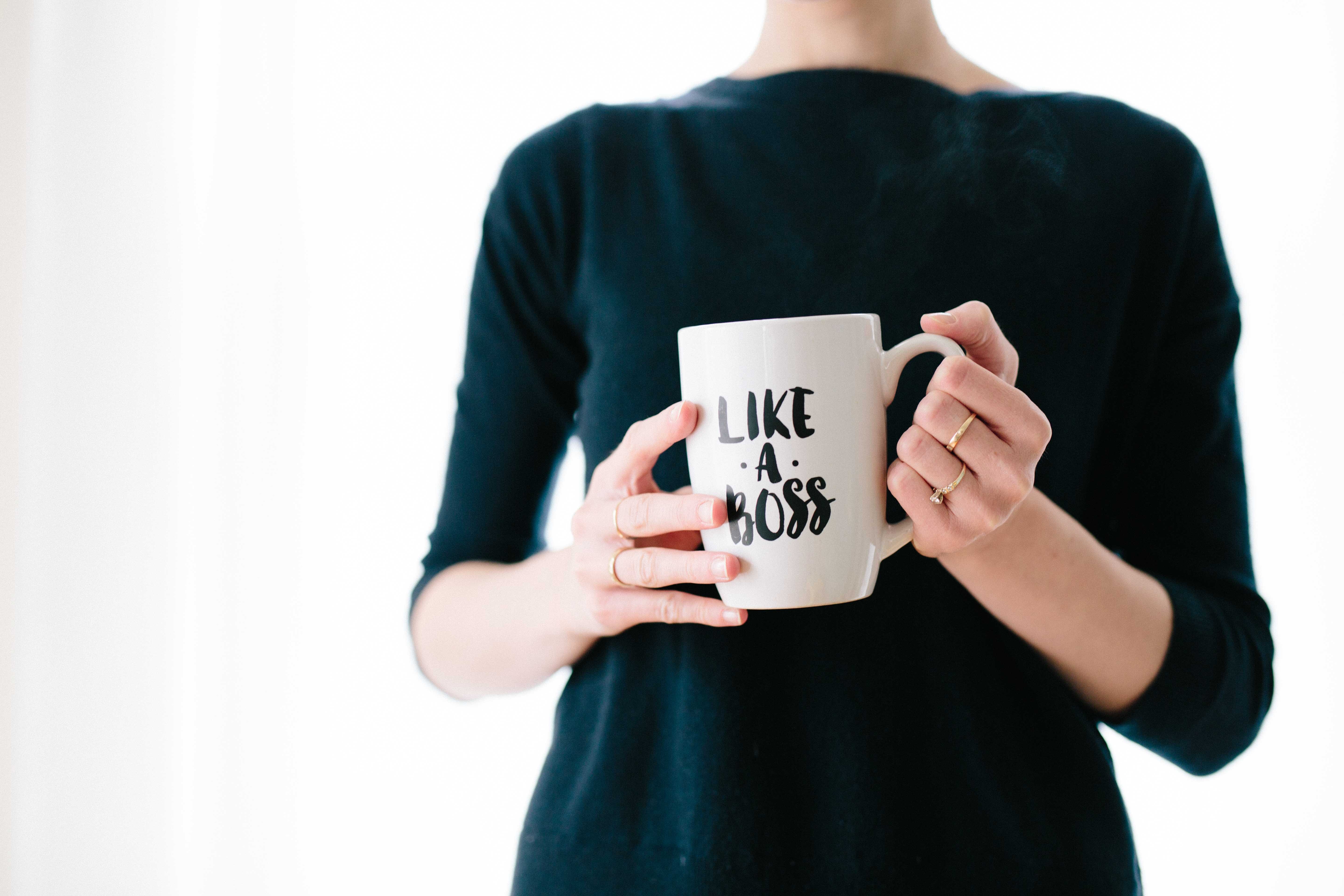 woman holds a mug