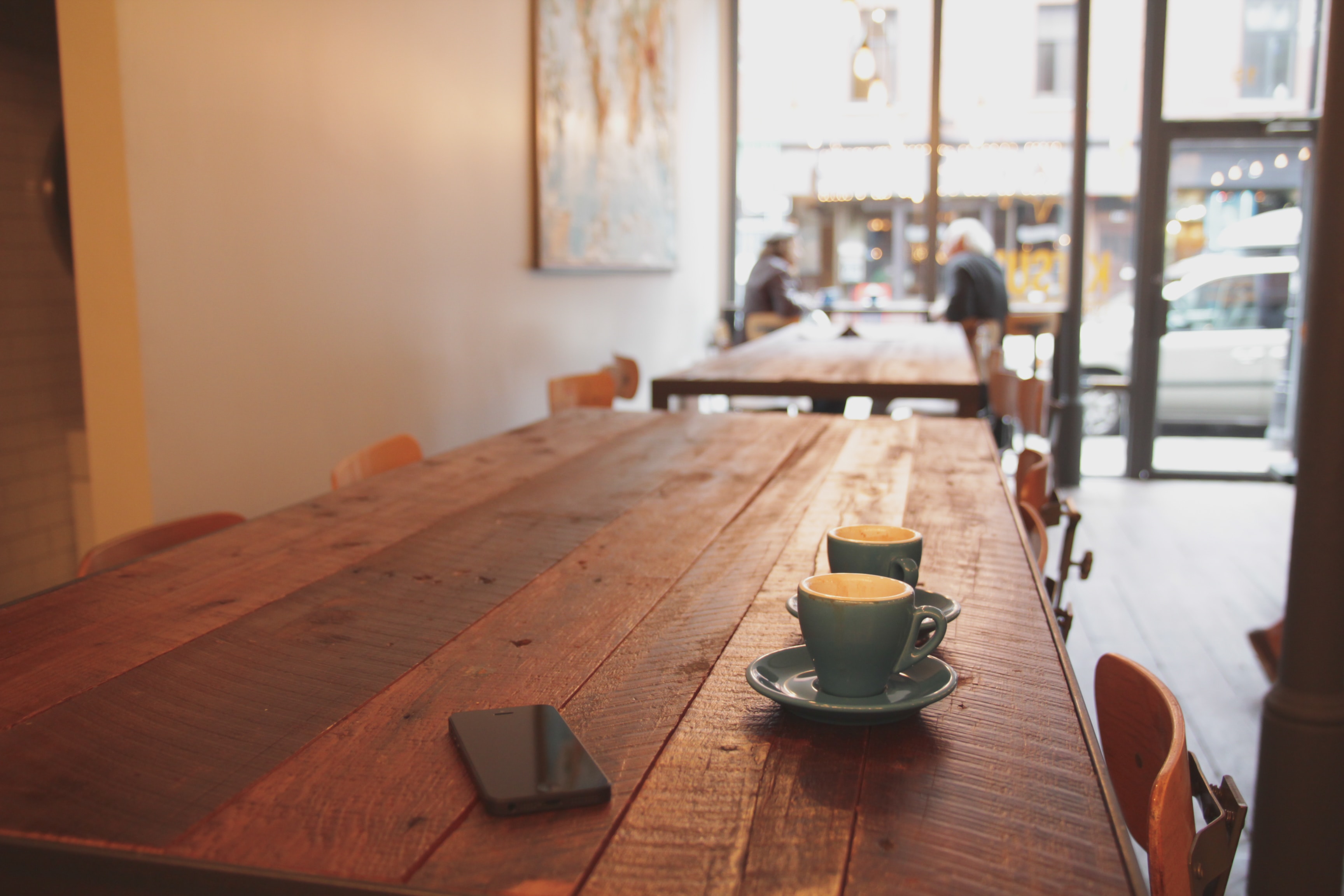 coffee cups on a table in a coffee shop