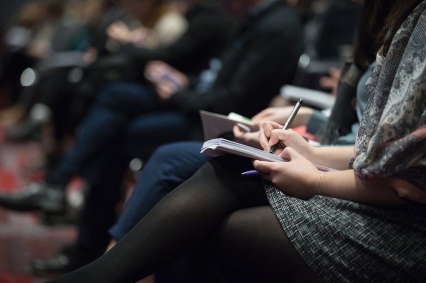 students take notes during a lecture