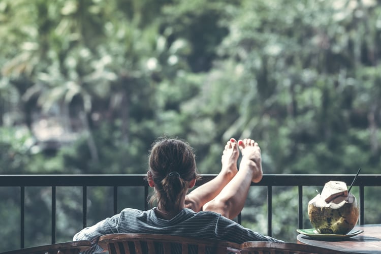 Woman sitting on balcony 