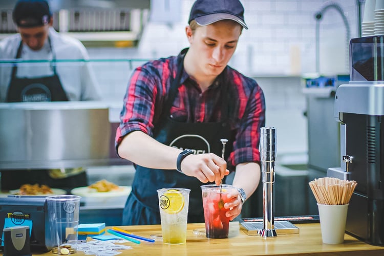 man working behind counter