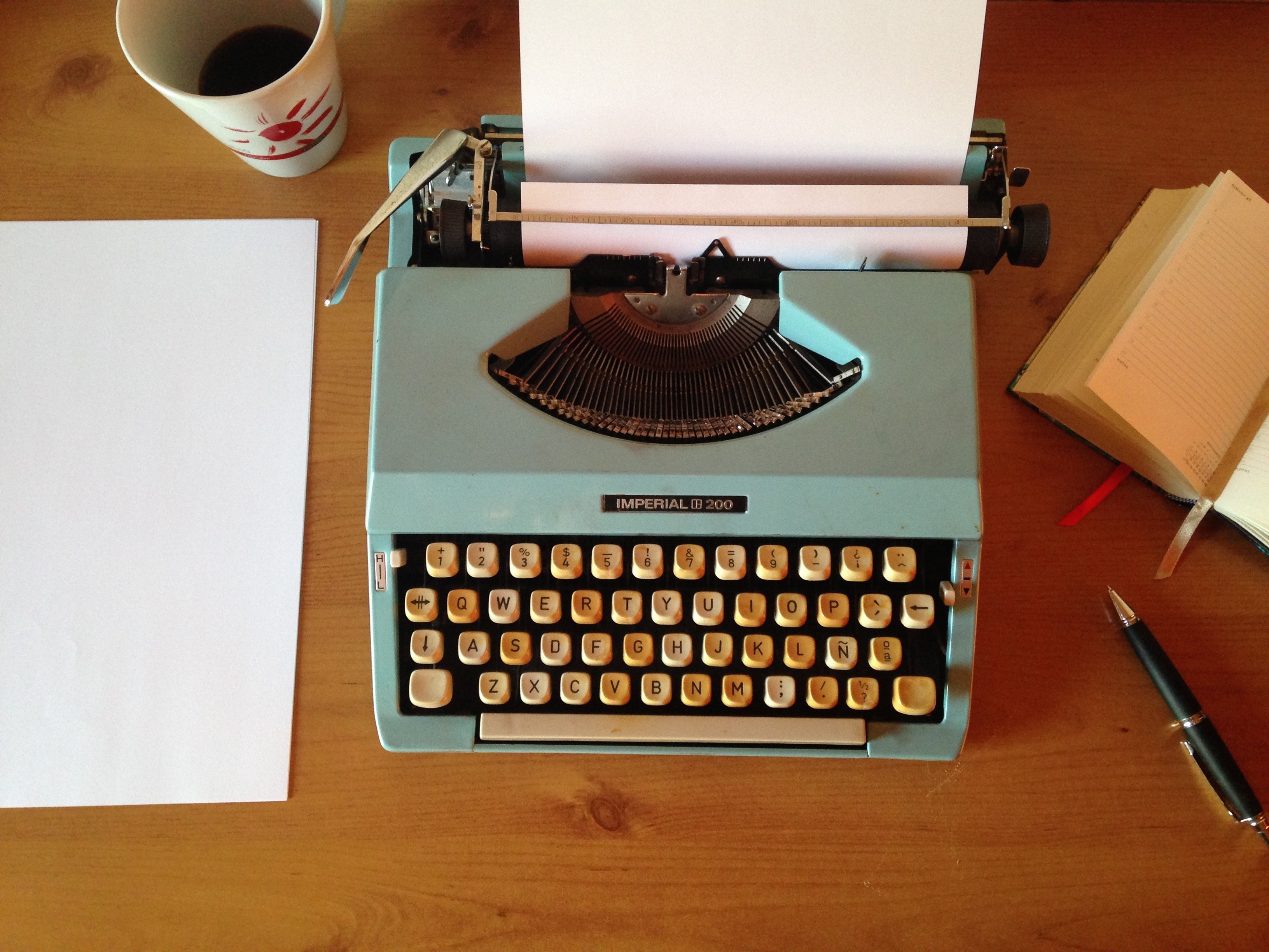 a typewriter sits on a table 