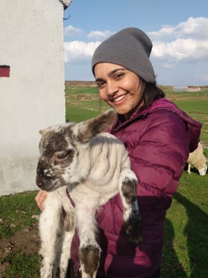 Zahra holding a goat