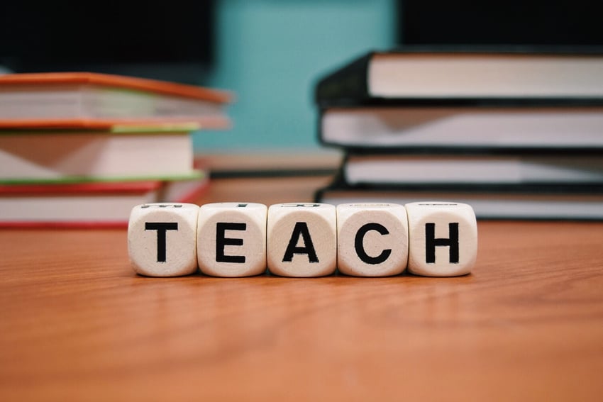 teach spelled out with letter blocks