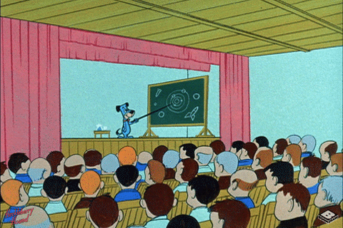 Dog as a teacher, pointing to a chalk board in lecture full of students