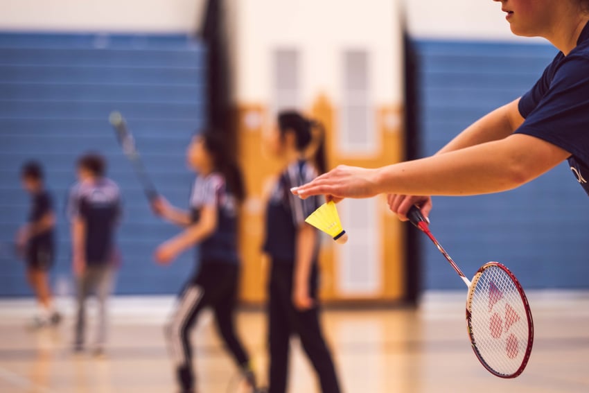 Group of people playing badminton