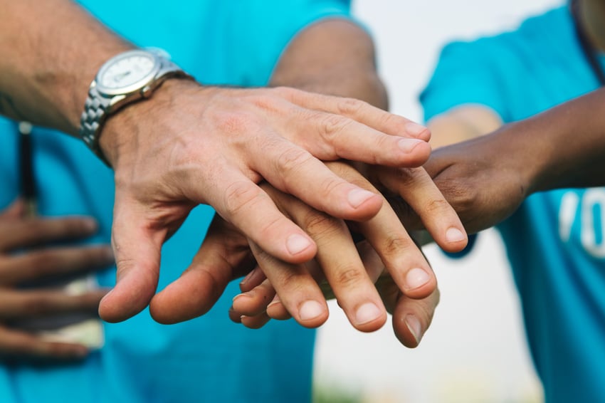 group of hands stacked