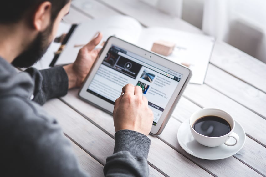 Man looking at tablet