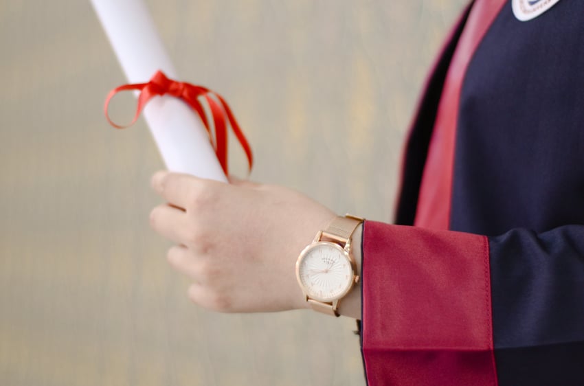 Man holding Diploma