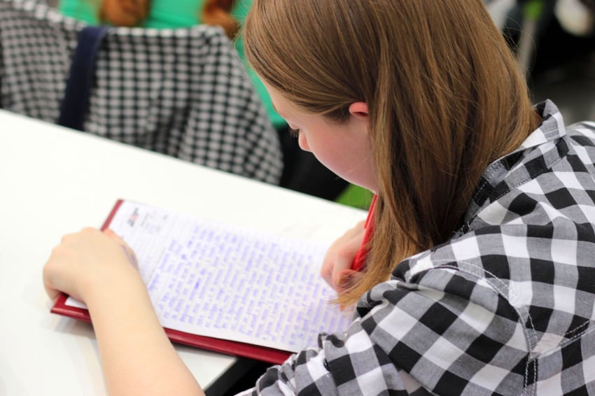 Girl writing in notebook