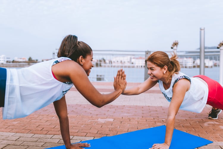 girls high-fiving each other