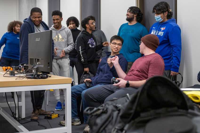 Group of students gaming on a computer