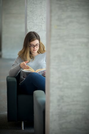 Erin studying in the library