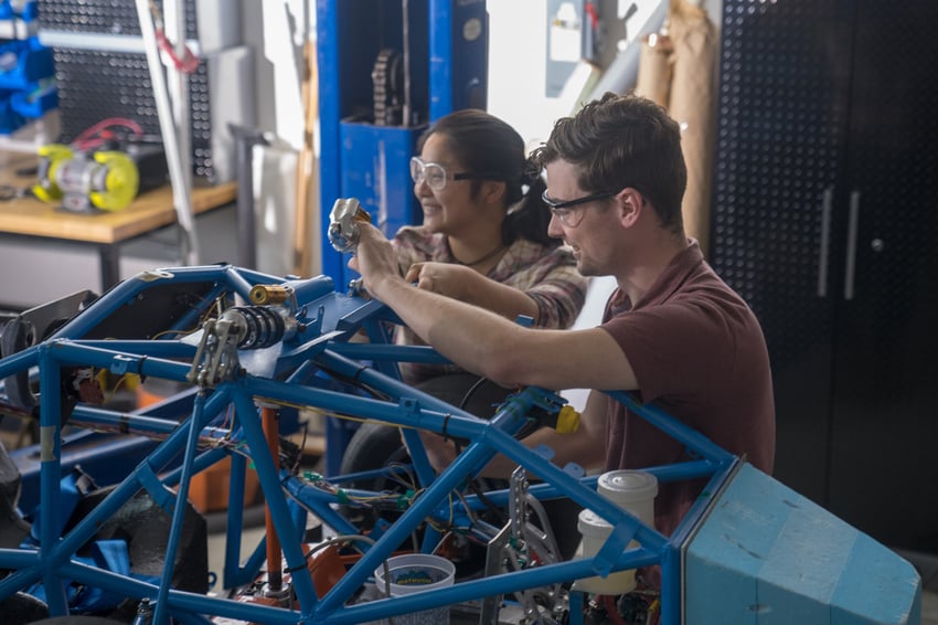 Two students working in the mechatronics laboratory.