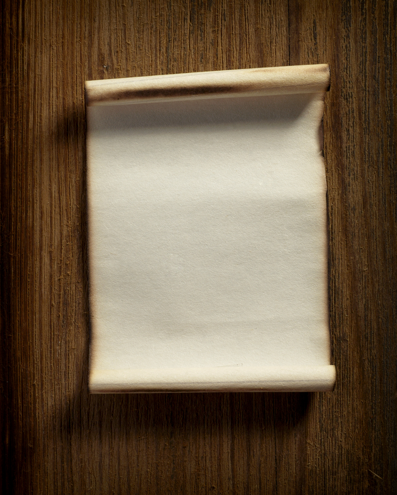 close up of grunge note paper on wooden background