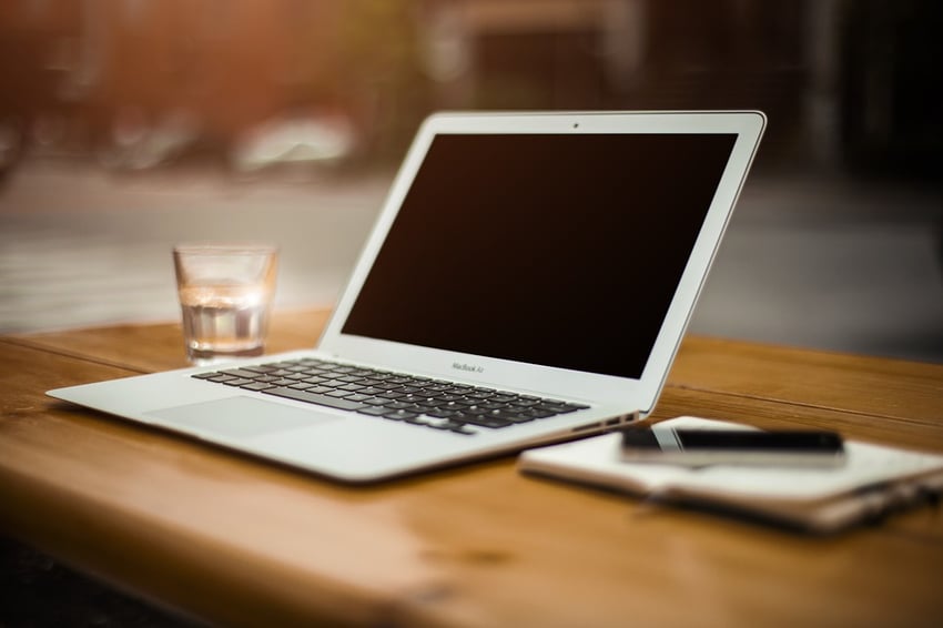 lap top on a wooden table