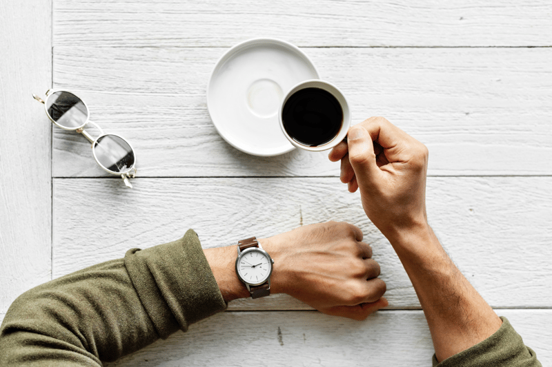 person checking the time on their watch