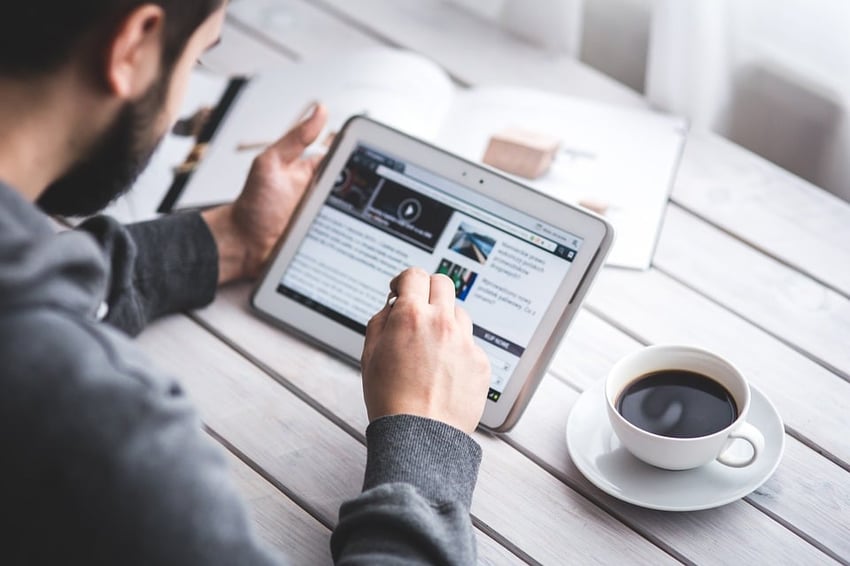 Man doing research on a tablet