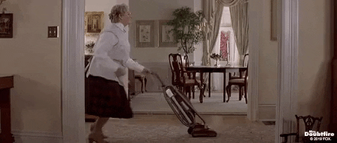 Gif of Mrs. Doubtfire dancing while vacuuming 