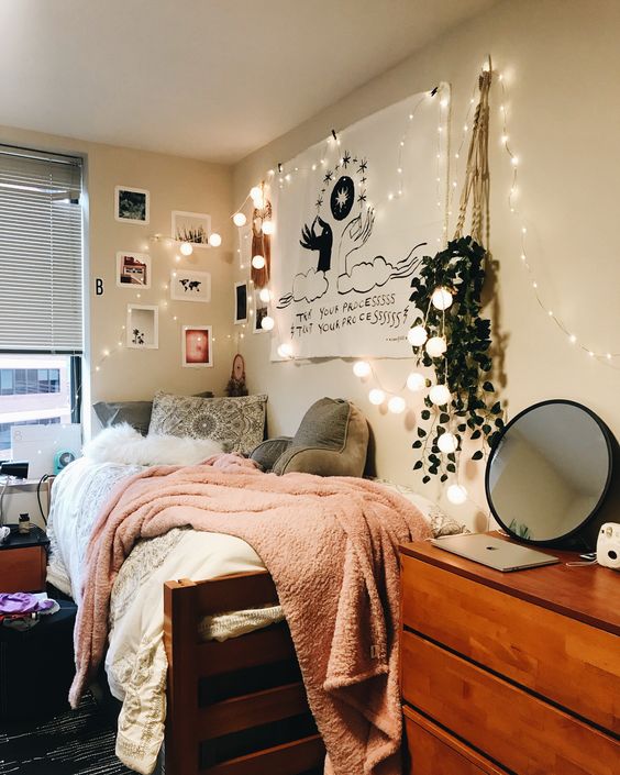 Bedroom with lights and pictures on the wall